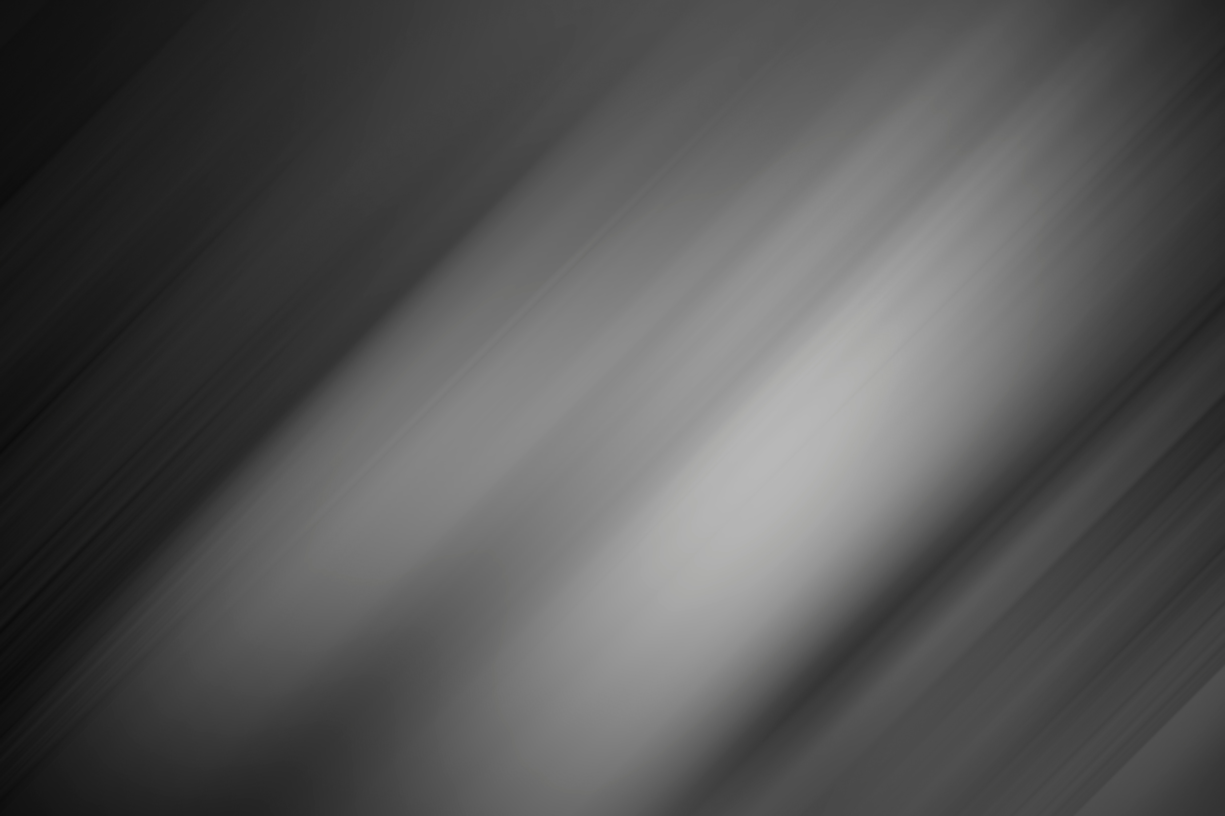 Black and gray background with gradient and silver light as background.